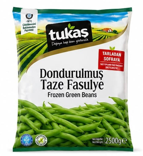 A 2500g bag of Tukas Frozen Green Beans (Dondurulmusı Taze Fasulye) on a clean white background. The packaging features a green field illustration, a clear window showing fresh green beans, and a red label indicating 'Tarladan Sofraya' (directly from the field).